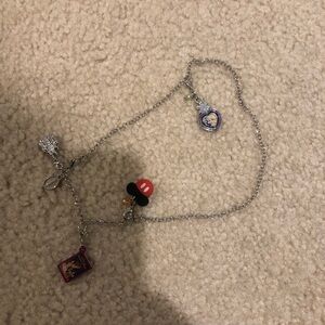 Silver Disney World charm necklace.
